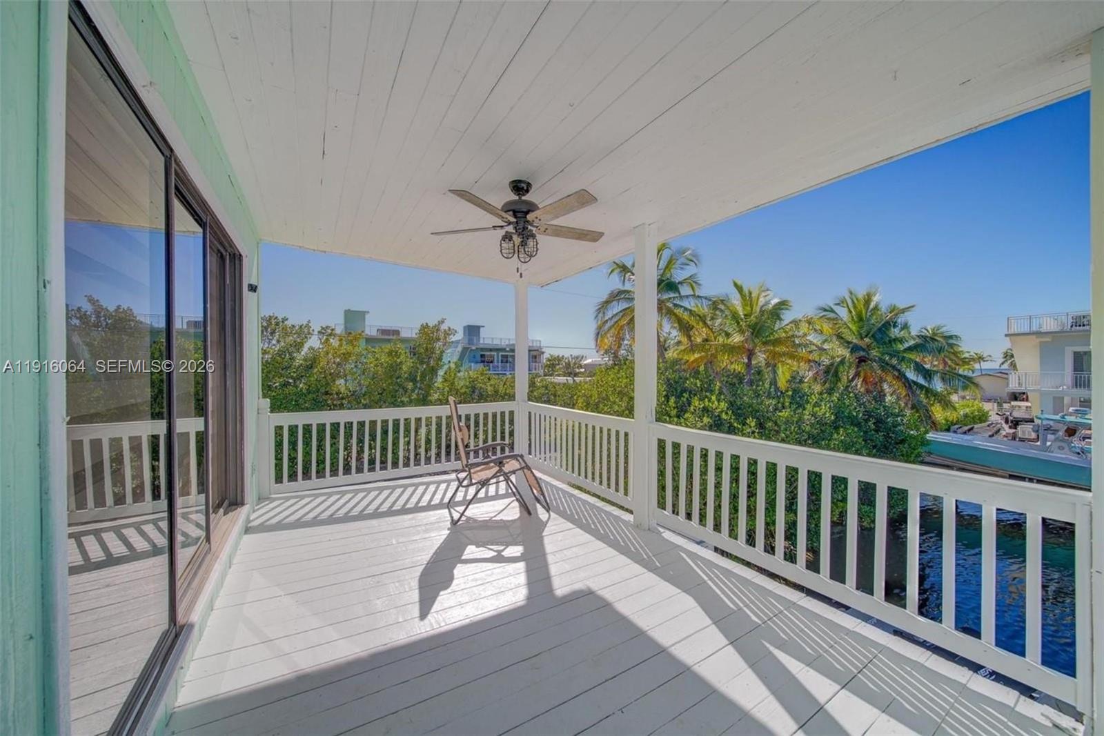 2 Snipe Road Key Largo, FL 33037 - Photo 11 of 45 a view of a balcony with a potted plant