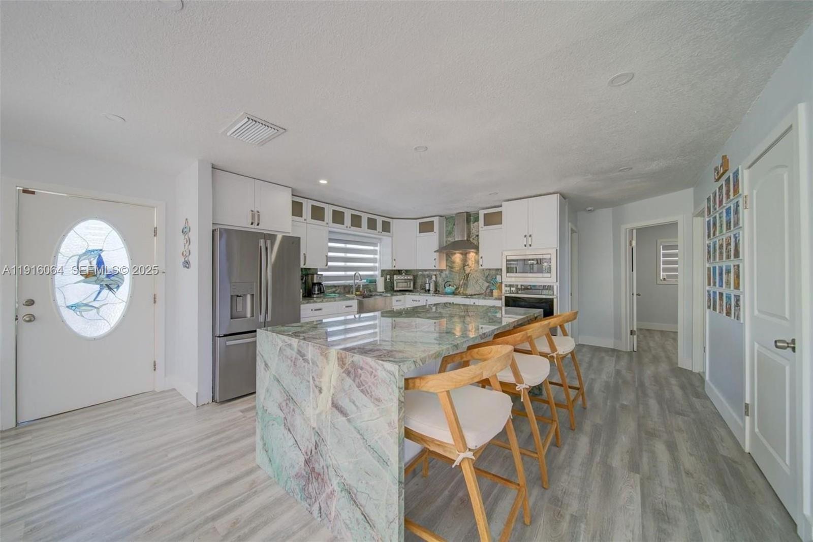 2 Snipe Road Key Largo, FL 33037 - Photo 12 of 41 a very nice looking room with a wooden floor