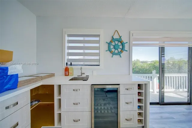 a kitchen with a cabinets and window