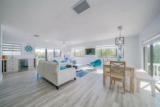 a living room with fireplace furniture and a wooden floor