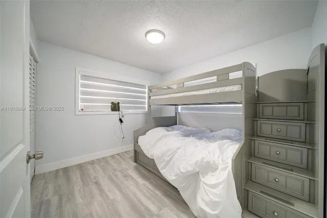 a bedroom with a bed and a closet