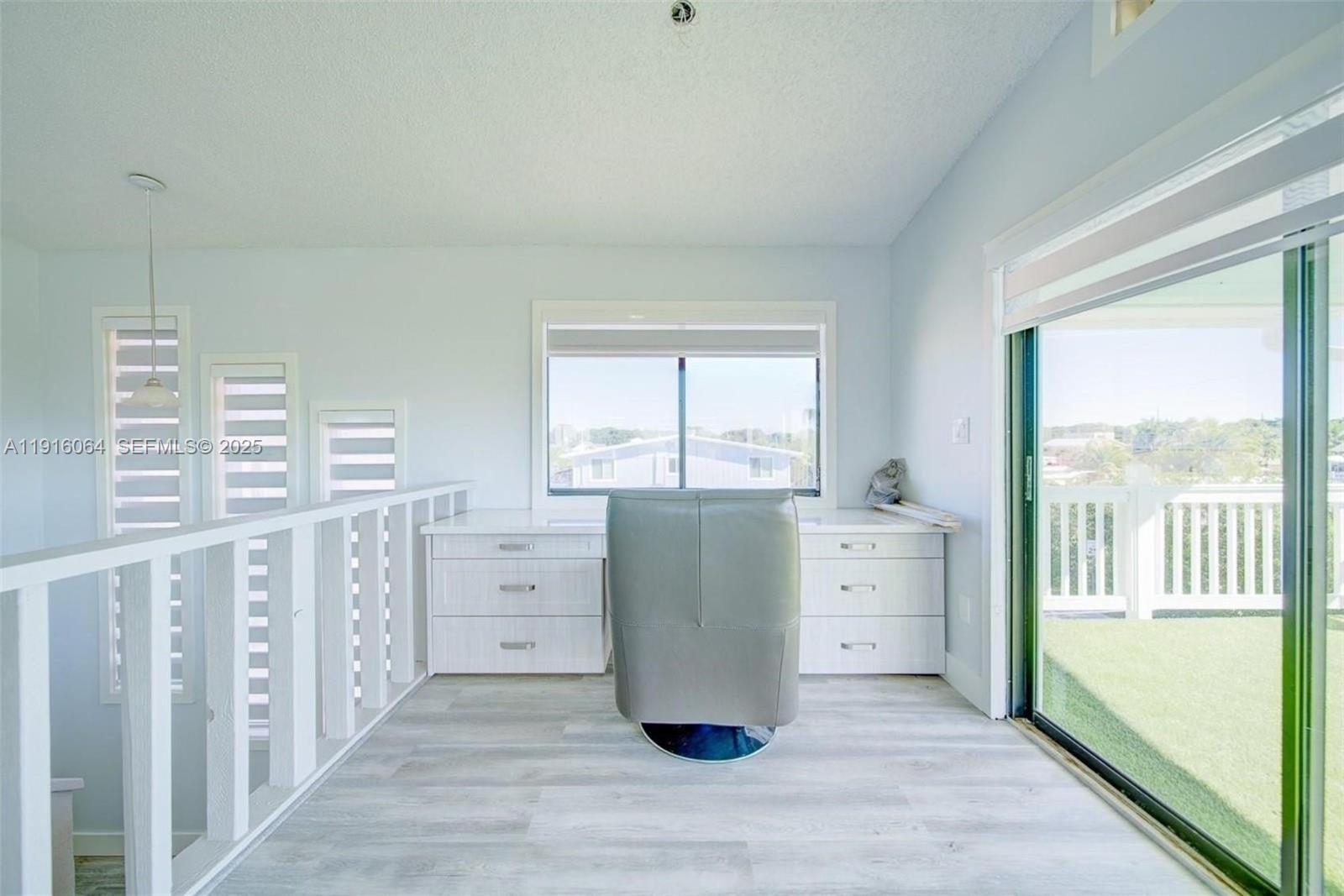 2 Snipe Road Key Largo, FL 33037 - Photo 22 of 41 a room with a large window and a dresser