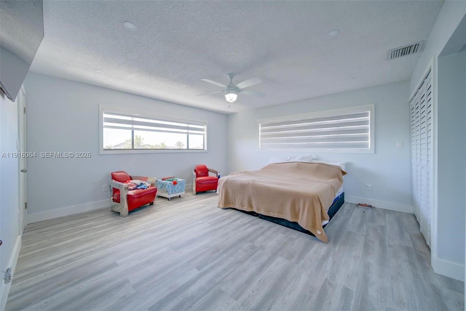 2 Snipe Road Key Largo, FL 33037 - Photo 24 of 45 a bedroom with furniture and wooden floor