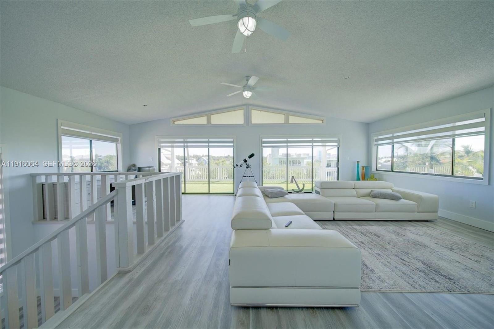 2 Snipe Road Key Largo, FL 33037 - Photo 28 of 45 a living room with furniture and a flat screen tv