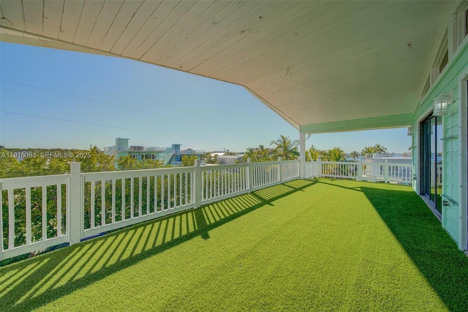2 Snipe Road Key Largo, FL 33037 - Photo 29 of 41 a view of a balcony with yard