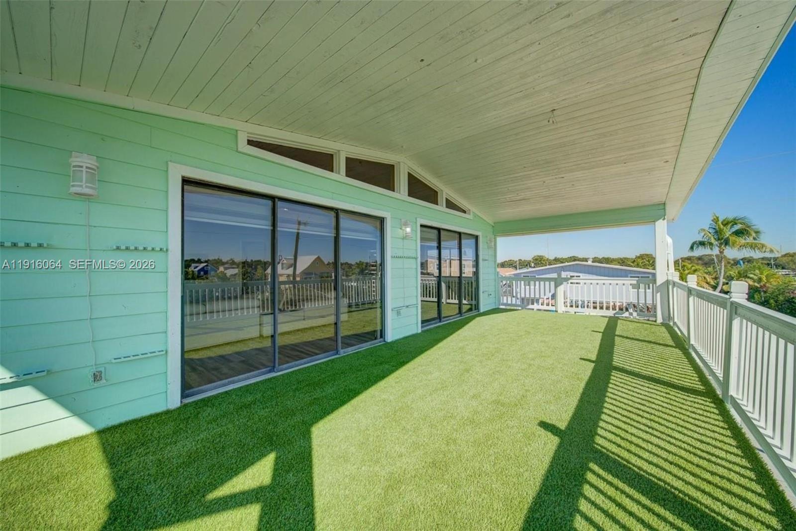 2 Snipe Road Key Largo, FL 33037 - Photo 30 of 45 a view of a porch and garden