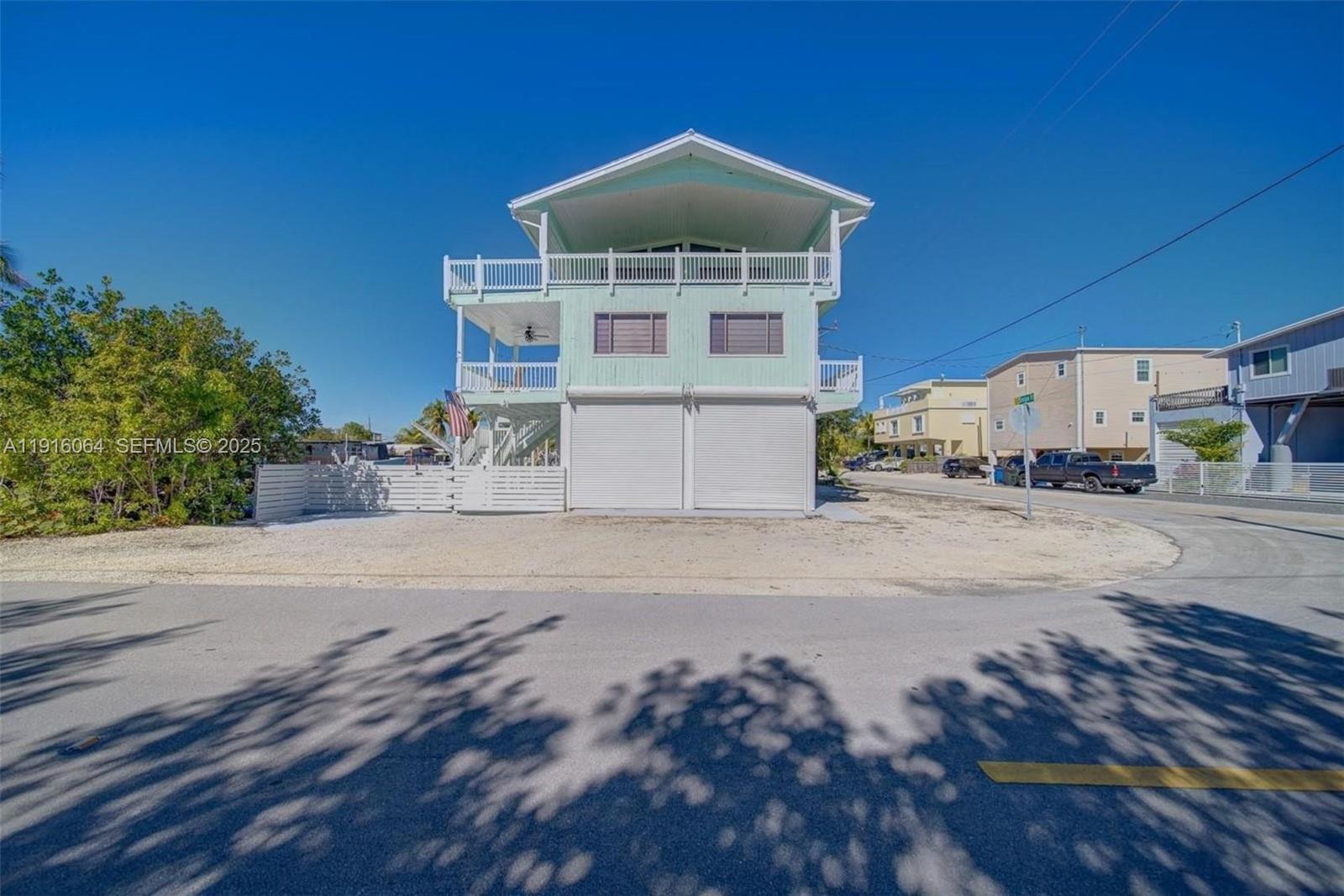 2 Snipe Road Key Largo, FL 33037 - Photo 32 of 41 a front view of a house with a yard