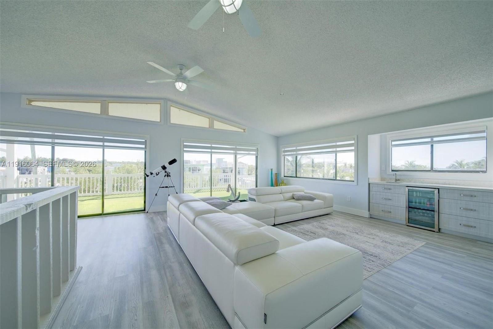 2 Snipe Road Key Largo, FL 33037 - Photo 5 of 45 a living room with furniture and large windows