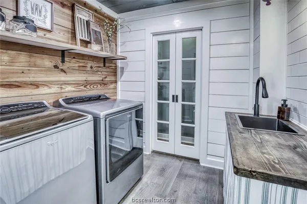 a kitchen with stainless steel appliances granite countertop a stove and a sink