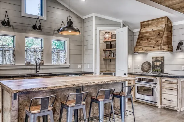 a kitchen with a stove and a sink