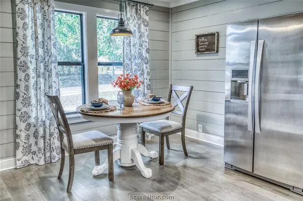 a dining room with furniture and window