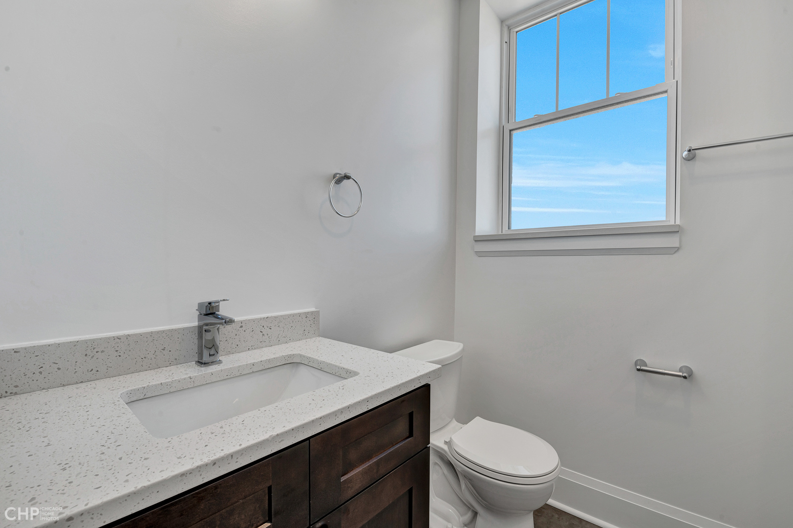 2100 North Halsted Street, Unit 4R Chicago, IL 60614 - Photo 12 of 26 a bathroom with a sink a toilet and window