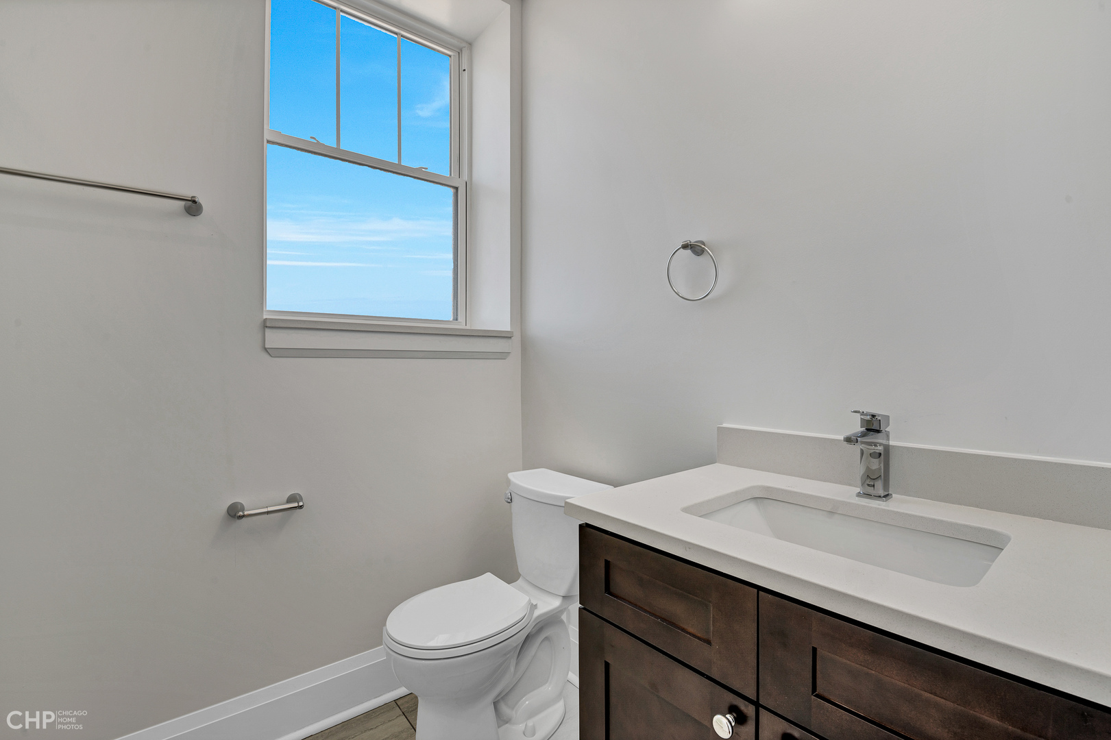2100 North Halsted Street, Unit 4R Chicago, IL 60614 - Photo 16 of 26 a bathroom with a sink a toilet and with mirror