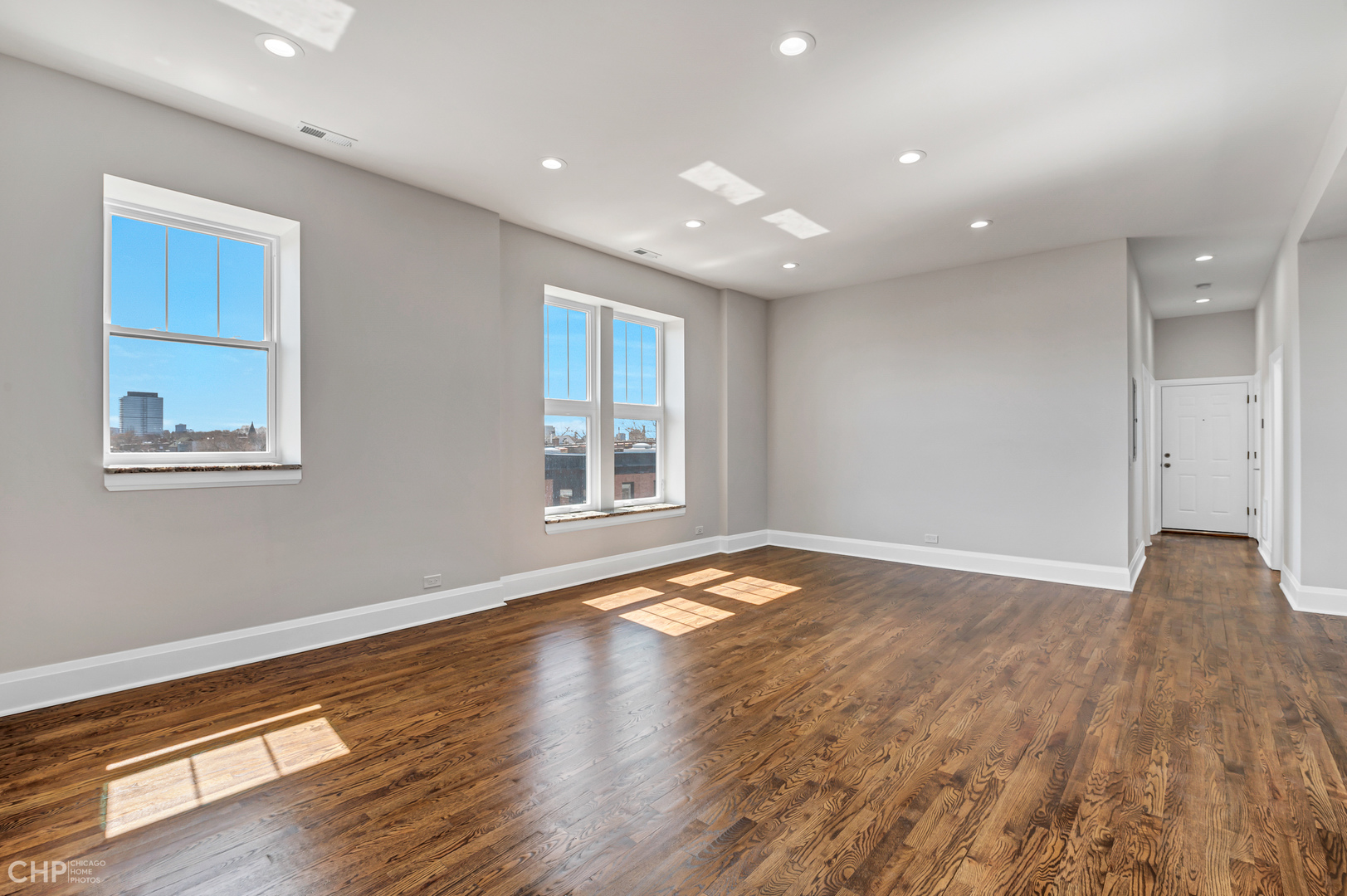 2100 North Halsted Street, Unit 4R Chicago, IL 60614 - Photo 26 of 26 a view of an empty room with wooden floor and a window