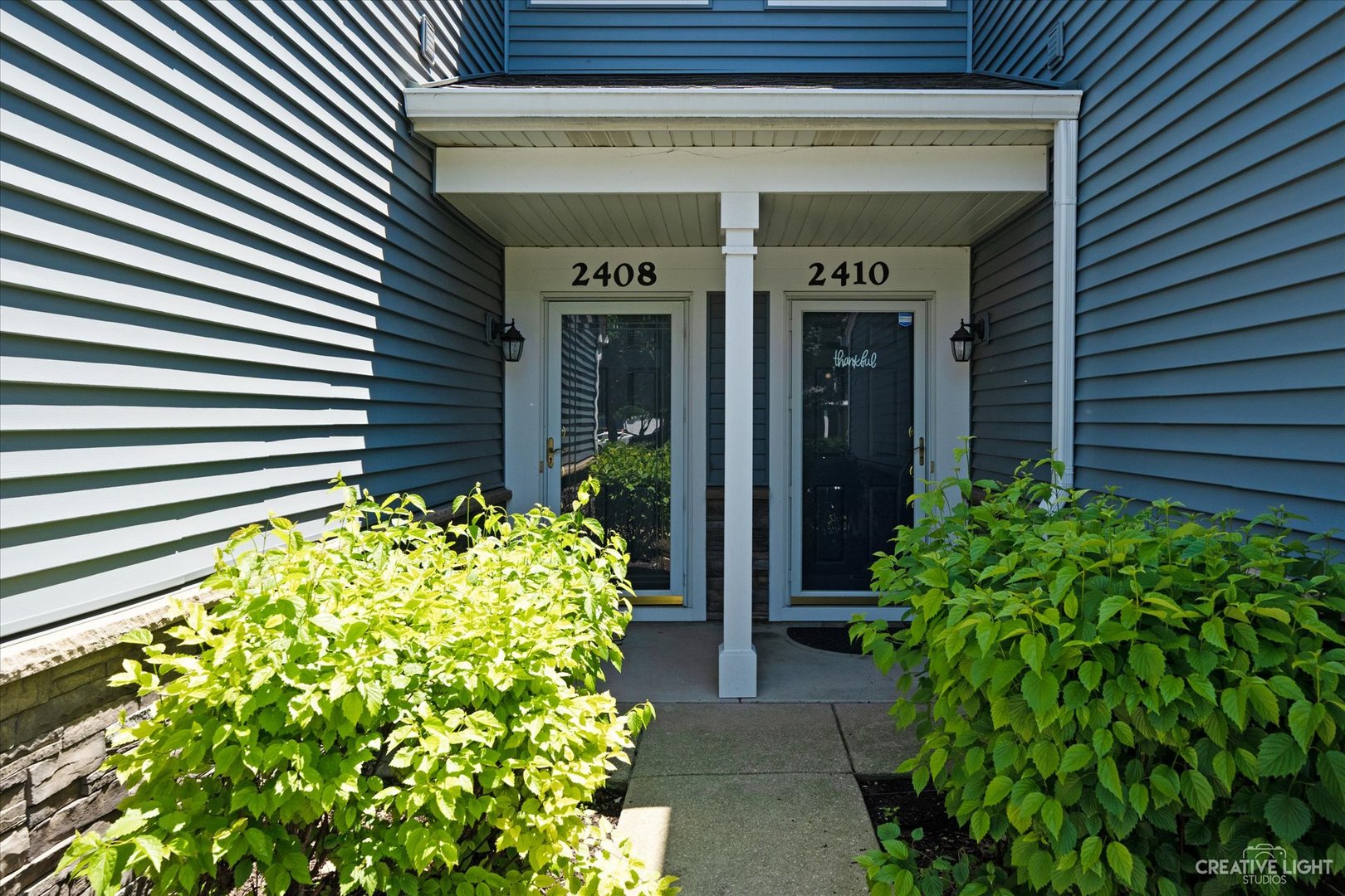 2408 Oneida Lane Naperville, IL 60563 - Photo 2 of 17 a view of a pathway of the house front of a house
