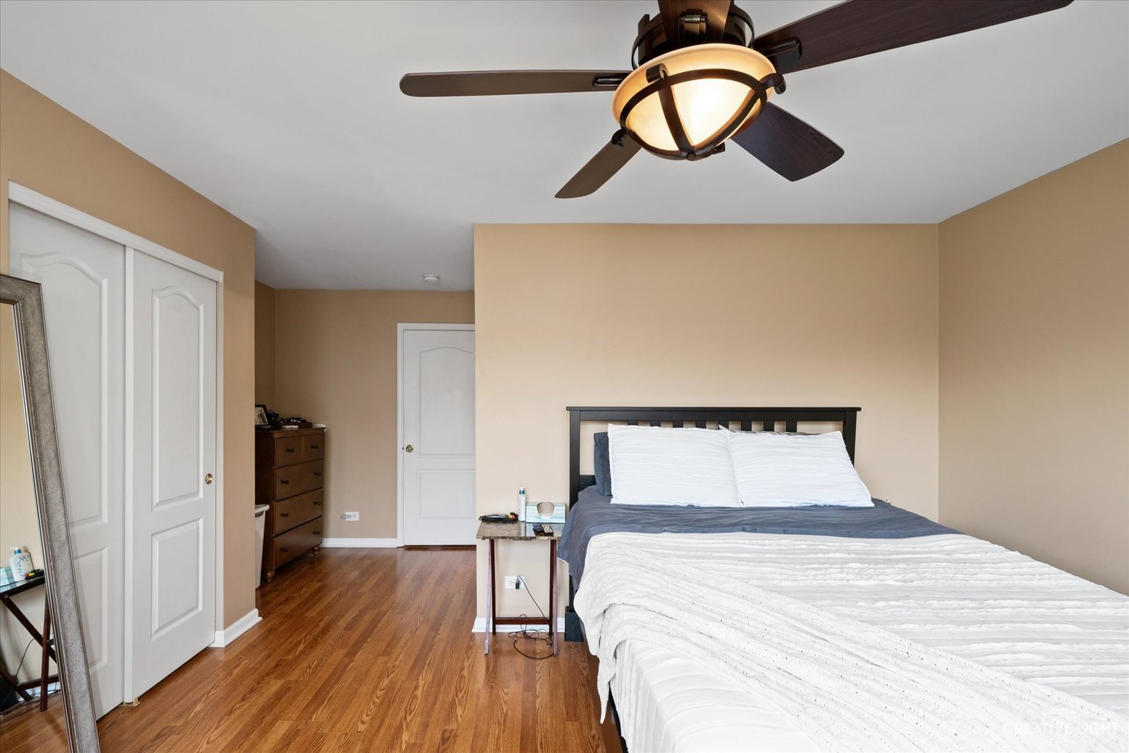 2408 Oneida Lane Naperville, IL 60563 - Photo 9 of 17 a bedroom with a bed and a painting on the wall