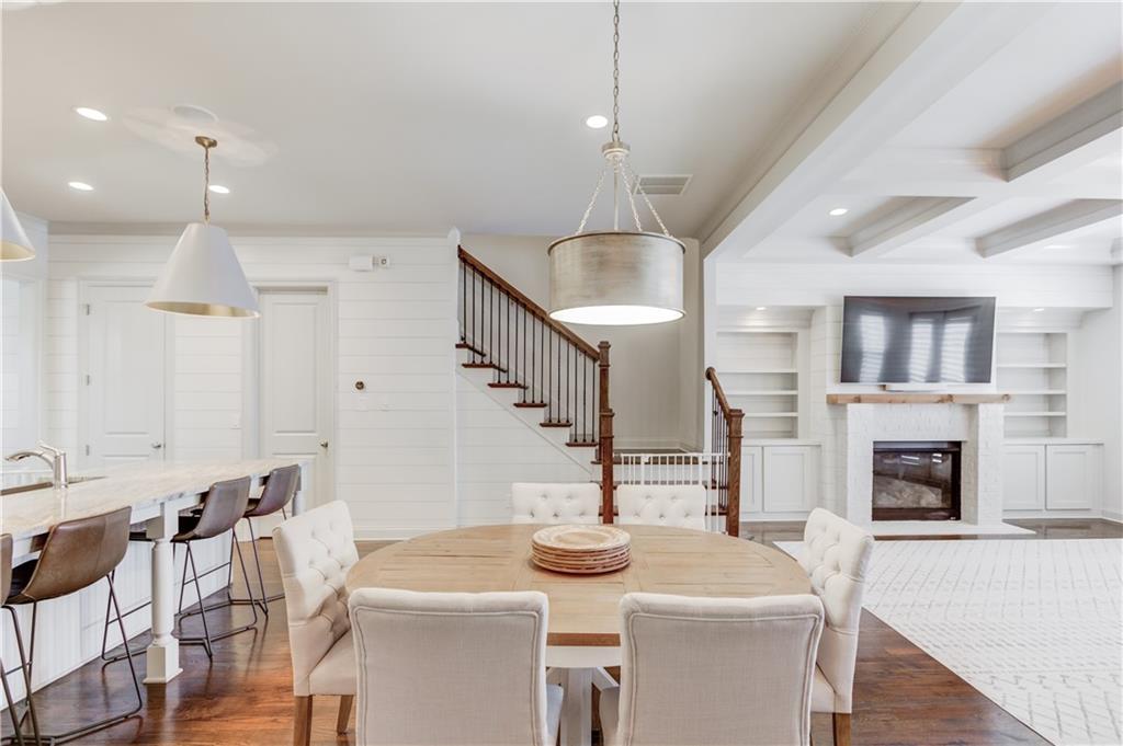 1816 Falling Sky Court Brookhaven, GA 30319 - Photo 12 of 44 a open kitchen with sink a stove and chairs