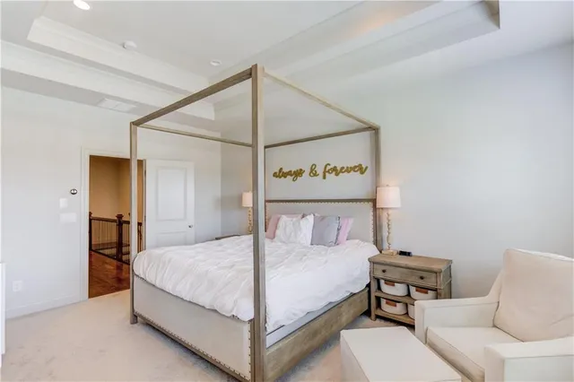 a bedroom with a bed and a table