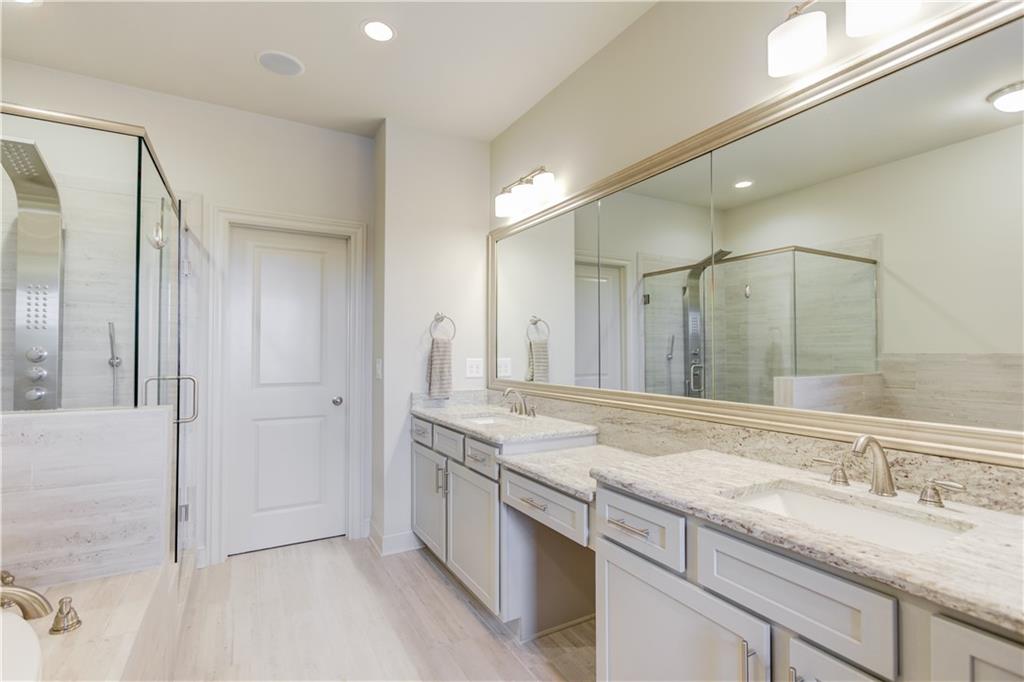 1816 Falling Sky Court Brookhaven, GA 30319 - Photo 20 of 44 a bathroom with a granite countertop sink mirror and double