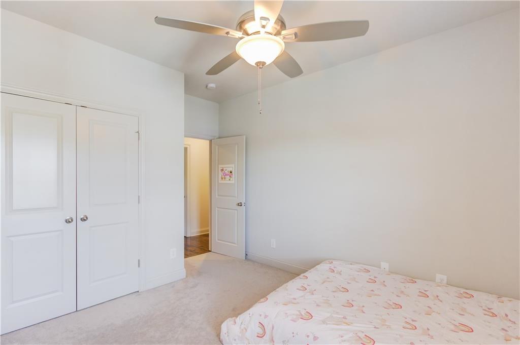 1816 Falling Sky Court Brookhaven, GA 30319 - Photo 25 of 44 an empty room with a fan & a ceiling fan