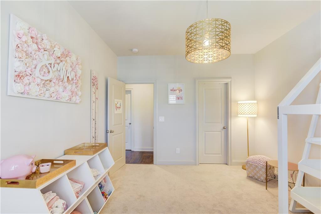 1816 Falling Sky Court Brookhaven, GA 30319 - Photo 26 of 44 a bedroom with a bed and a window