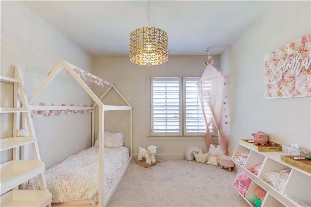 1816 Falling Sky Court Brookhaven, GA 30319 - Photo 27 of 44 a bedroom with furniture and a window