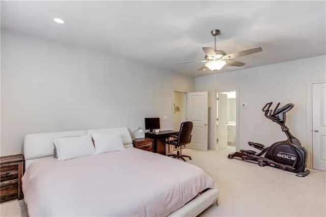 a bedroom with a bed and a gym equipment