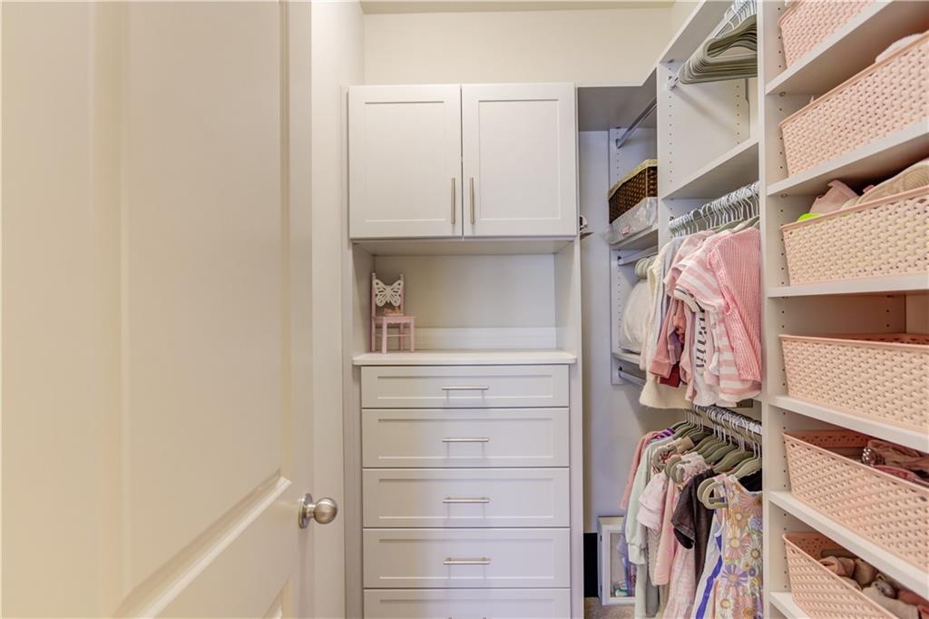 1816 Falling Sky Court Brookhaven, GA 30319 - Photo 37 of 44 a view of walk in closet with clothes and shoes