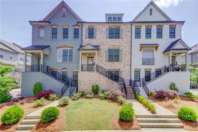 a front view of a building with small garden