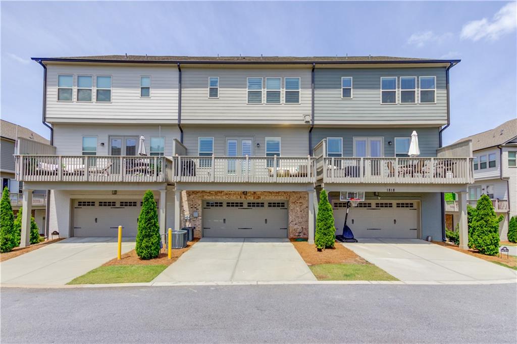1816 Falling Sky Court Brookhaven, GA 30319 - Photo 40 of 44 a front view of a building with small garden