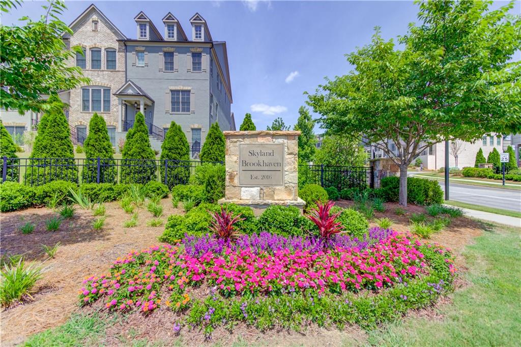 1816 Falling Sky Court Brookhaven, GA 30319 - Photo 44 of 44 a view of a house with a big yard and potted plants