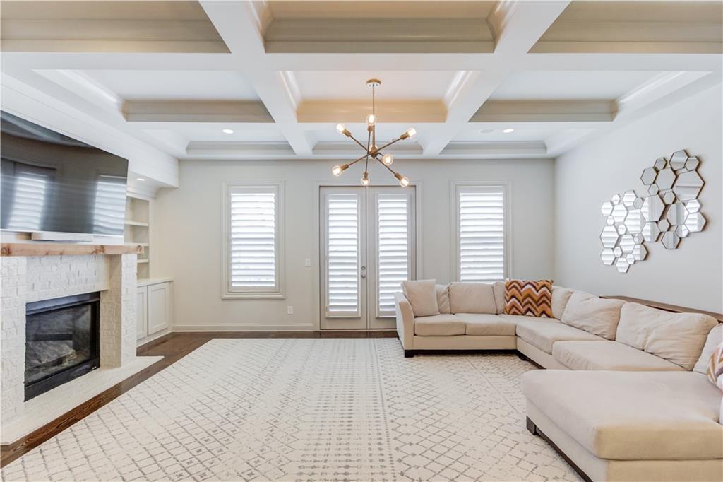 1816 Falling Sky Court Brookhaven, GA 30319 - Photo 6 of 44 a living room with furniture and a fireplace