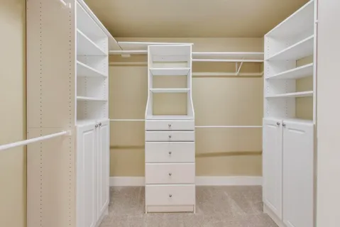 a view of an empty walk in closet
