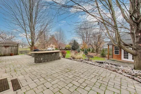 a view of a chairs and table in the patio