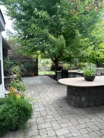 a view of a backyard with sitting area