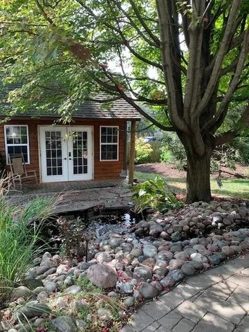 a backyard of a house with lots of green space