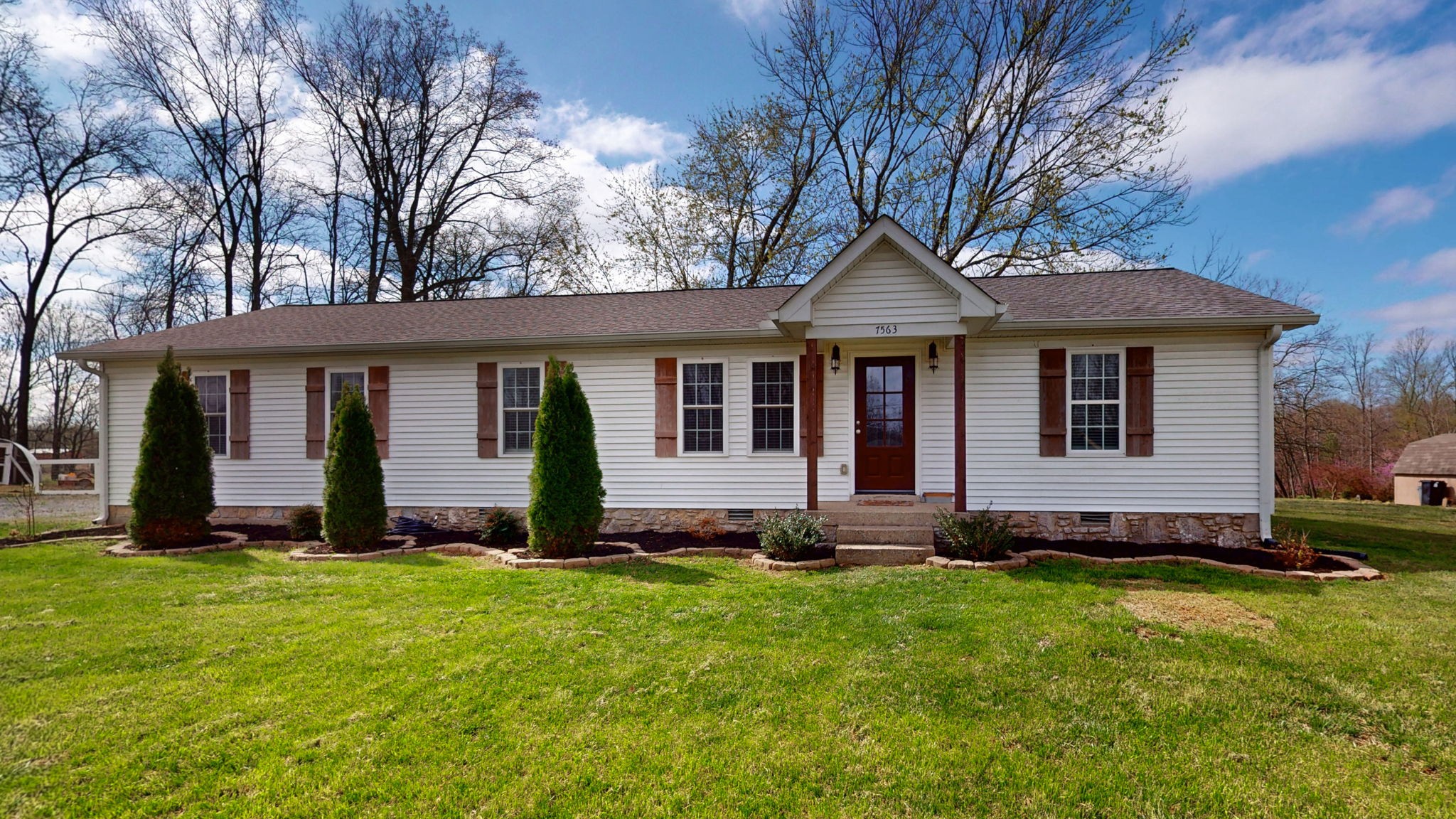 7563 South Swift Road Goodlettsville, TN 37072 - Photo 1 of 25 a front view of a house with a yard