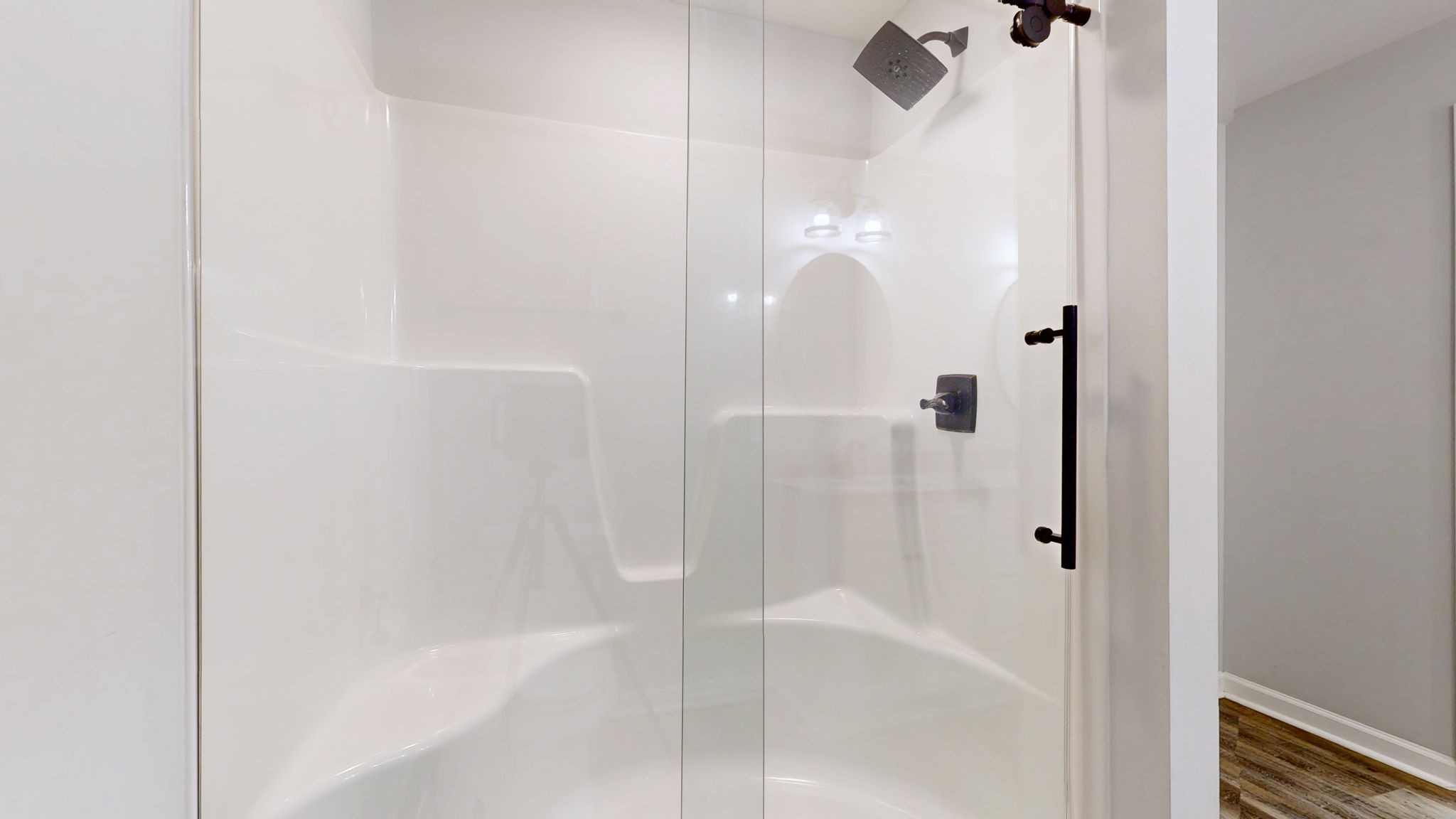 7563 South Swift Road Goodlettsville, TN 37072 - Photo 13 of 25 a bathroom with a bathtub and a shower
