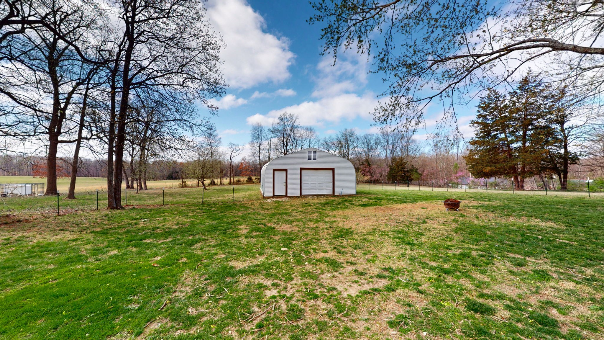 7563 South Swift Road Goodlettsville, TN 37072 - Photo 17 of 25 a tall tree in middle of green field