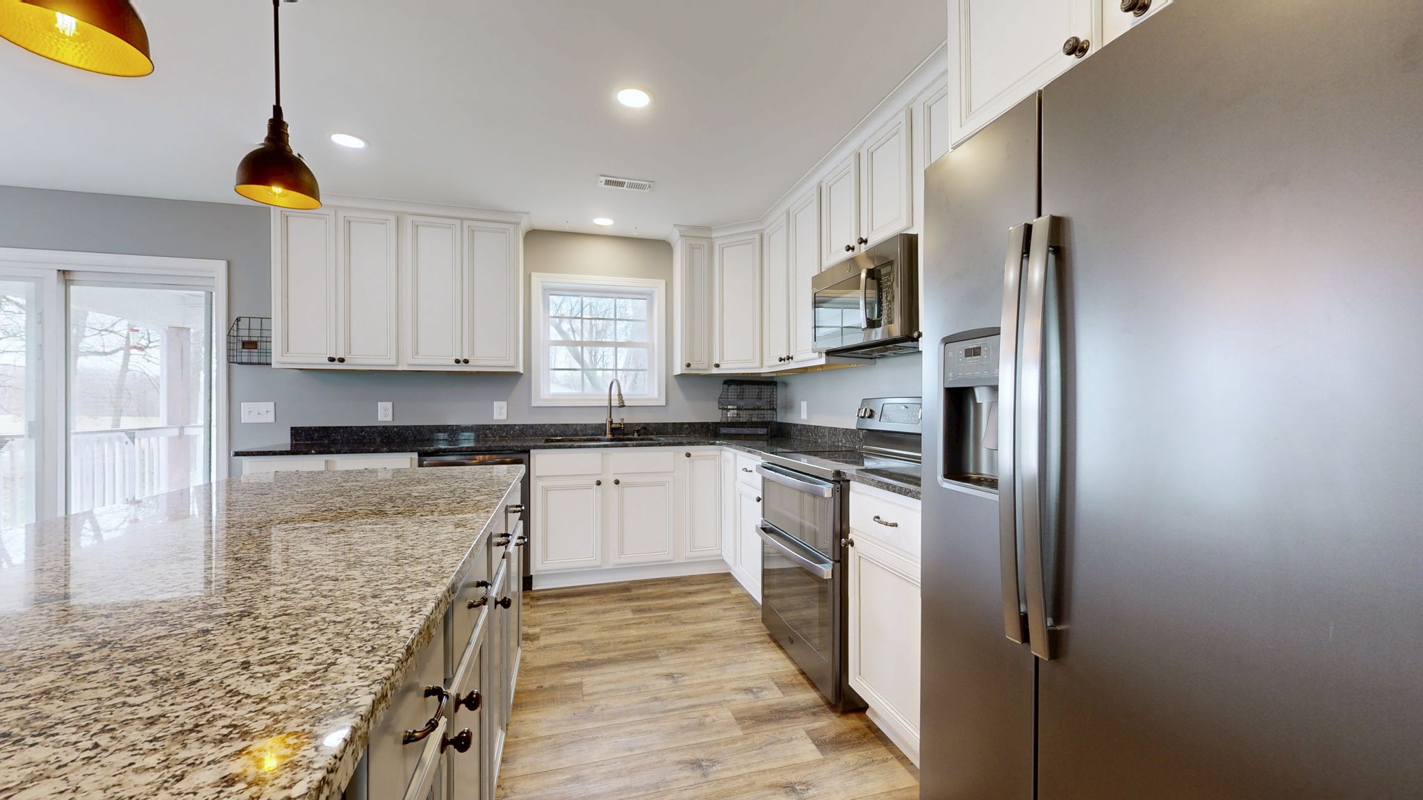 7563 South Swift Road Goodlettsville, TN 37072 - Photo 5 of 25 a kitchen with stainless steel appliances granite countertop a refrigerator and a stove top oven