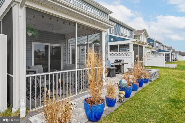 a view of a terrace with chairs and wooden floor