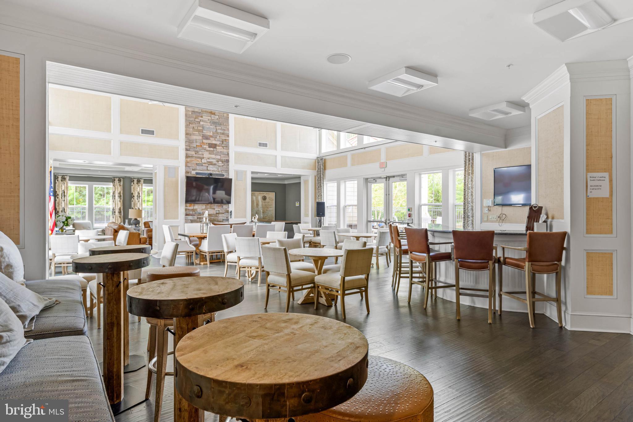 38053 Cross Gate Road Millville, DE 19967 - Photo 42 of 47 a view of a dining room with furniture window and wooden floor