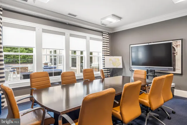 a view of a patio with table and chairs