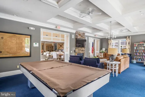 a living room with lots of furniture and white walls