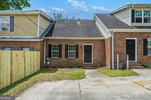 front view of a house with a yard