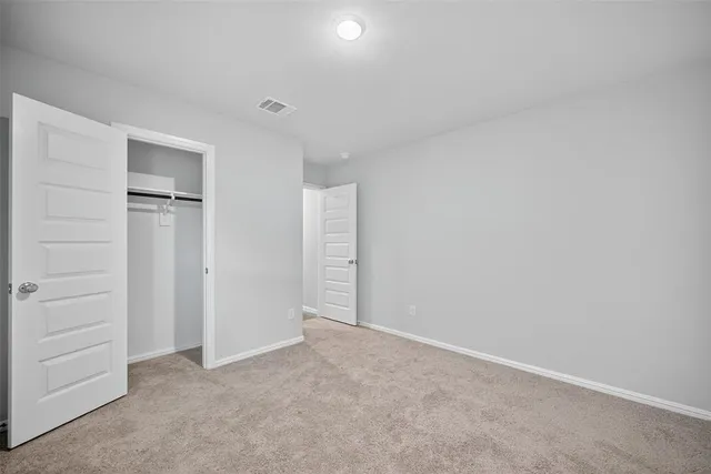 a view of kitchen with counter top space cabinets and stainless steel appliances
