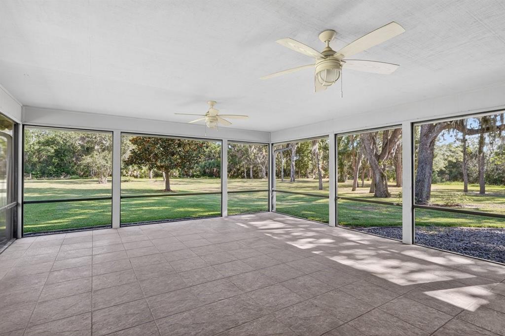 171 William Street Edgewater, FL 32141 - Photo 26 of 40 a view of a yard with porch