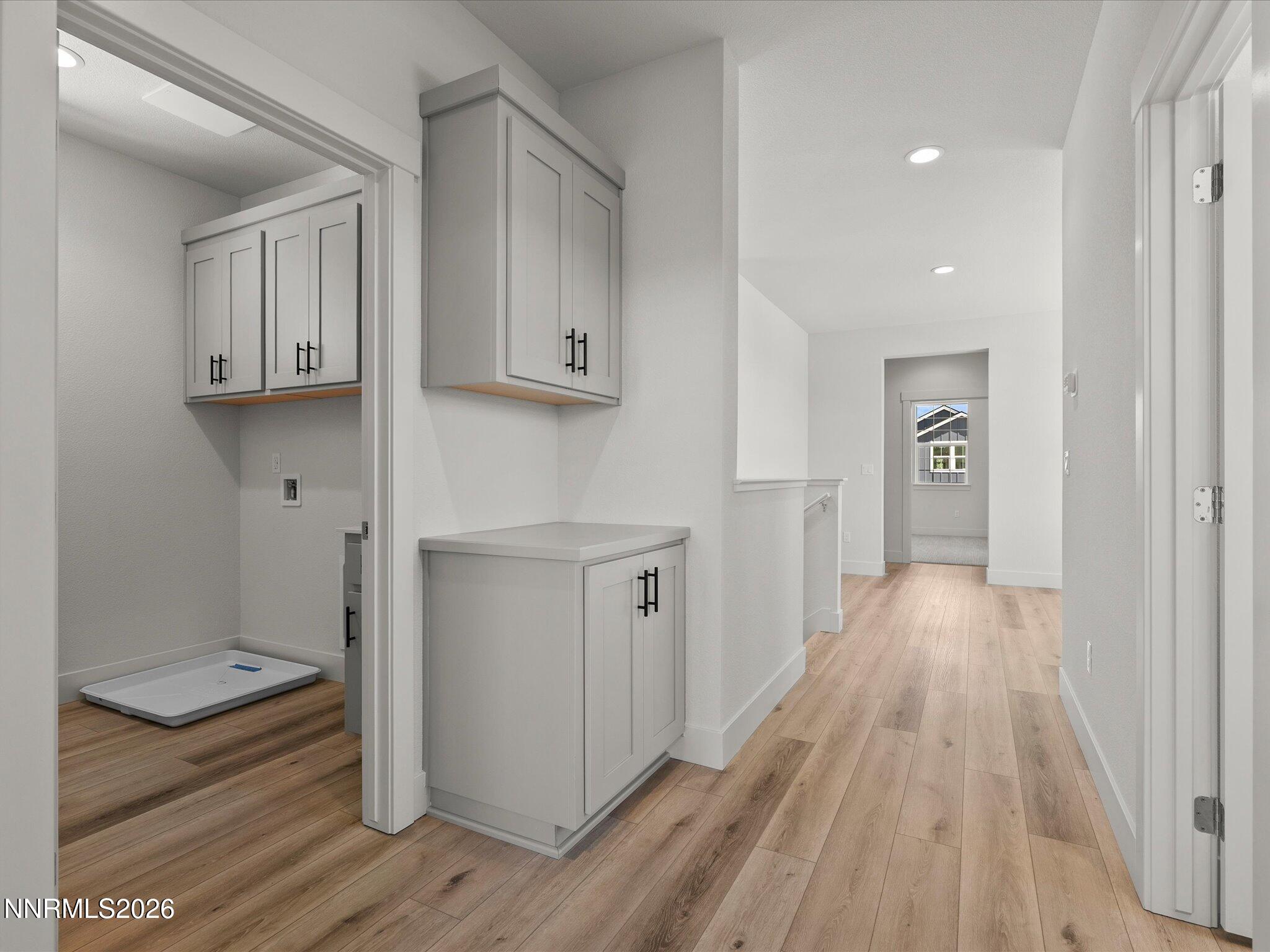 1383 Vine Gate Road, Unit HOMESITE 51 Carson City, NV 89701 - Photo 14 of 20 a view of a kitchen with wooden floor and electronic appliances