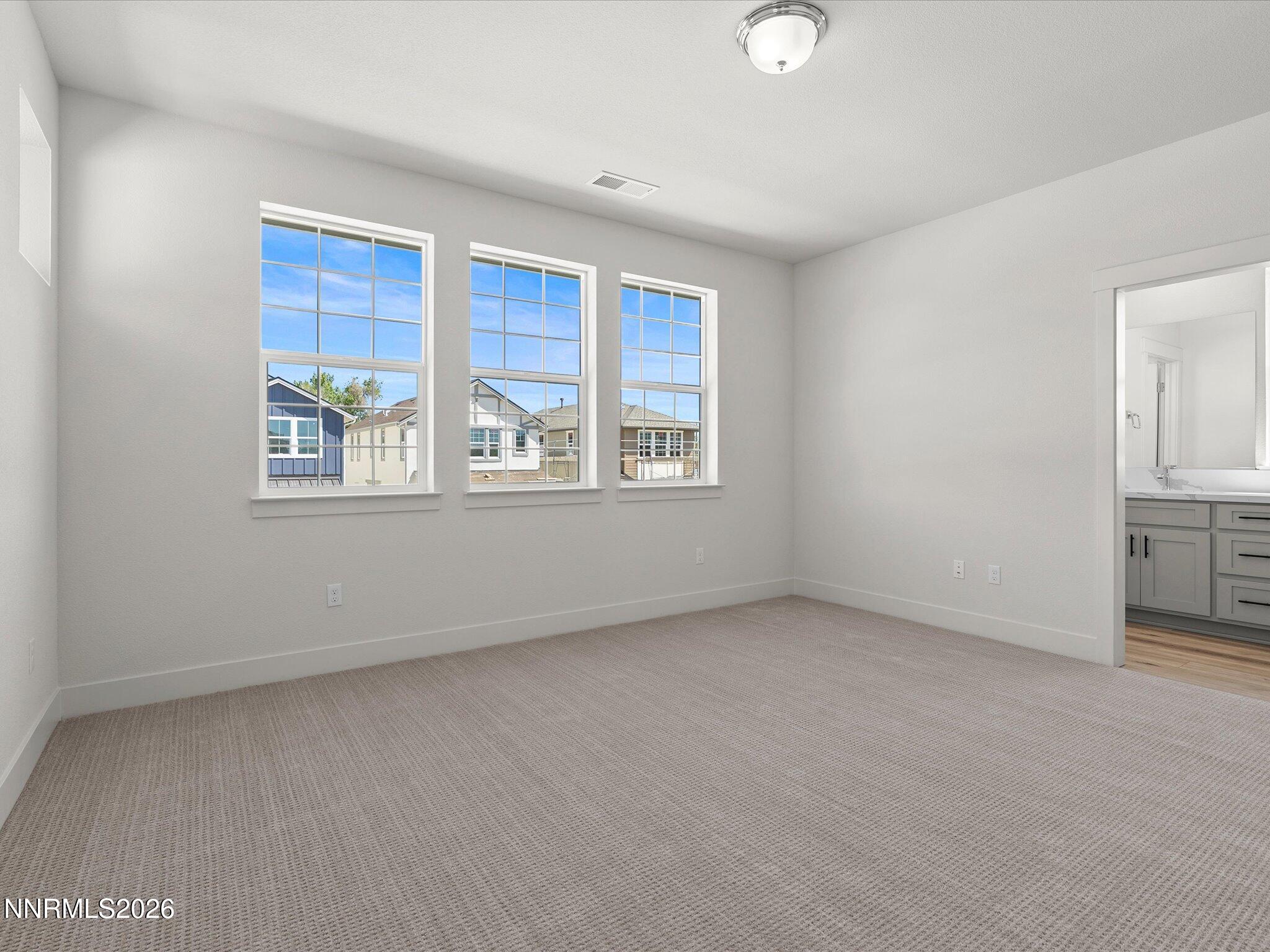 1383 Vine Gate Road, Unit HOMESITE 51 Carson City, NV 89701 - Photo 15 of 20 a view of an empty room with a window