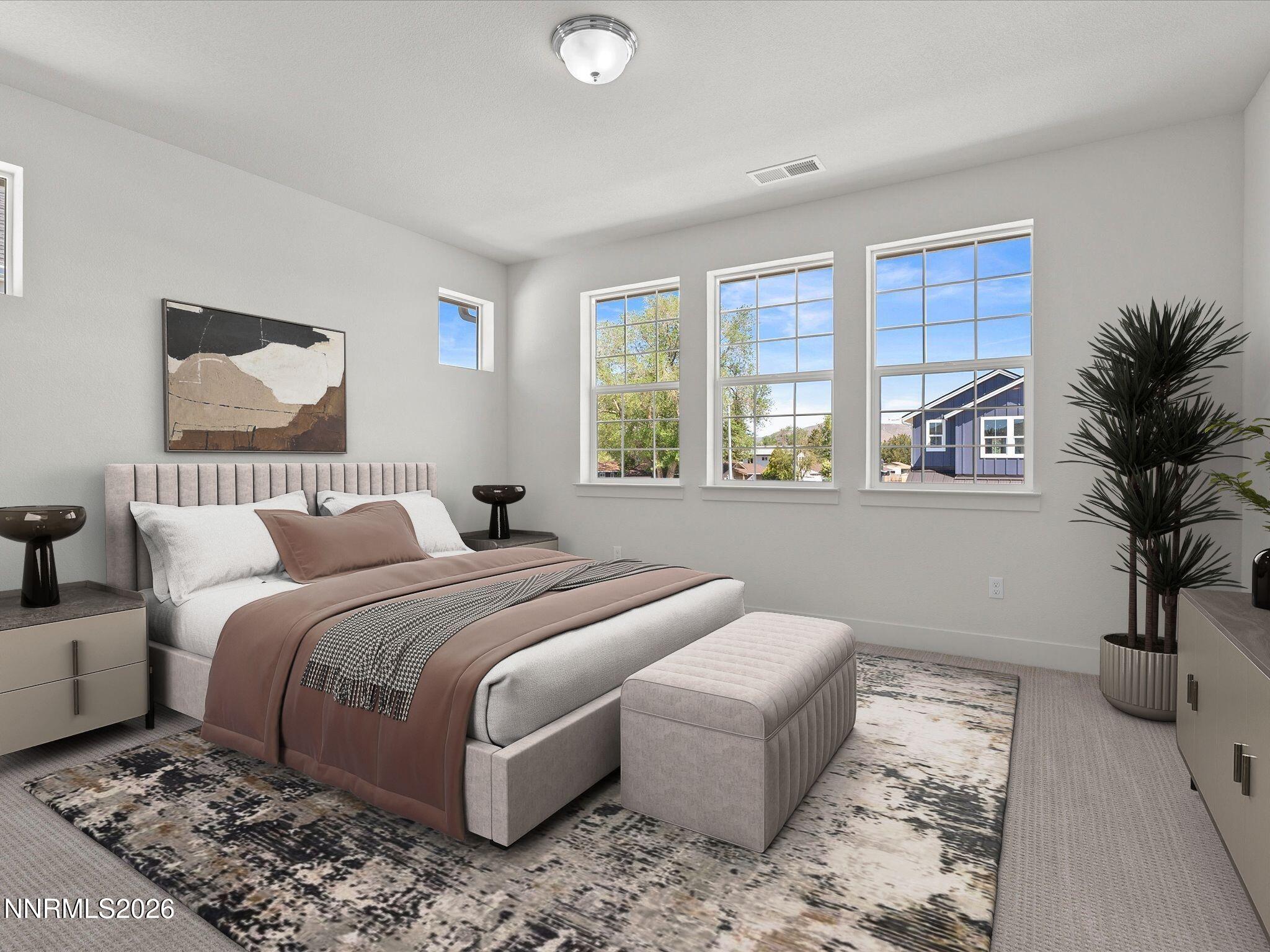 1383 Vine Gate Road, Unit HOMESITE 51 Carson City, NV 89701 - Photo 16 of 20 a bedroom with a large bed and a potted plant